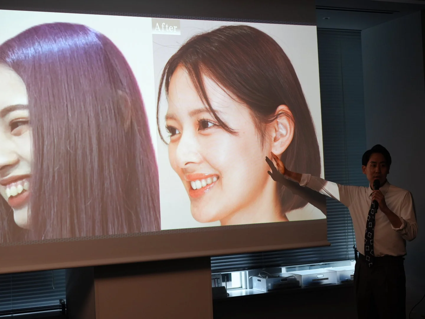 矯正GPOのセミナーでスライドを使って講義する院長 岡 矢人